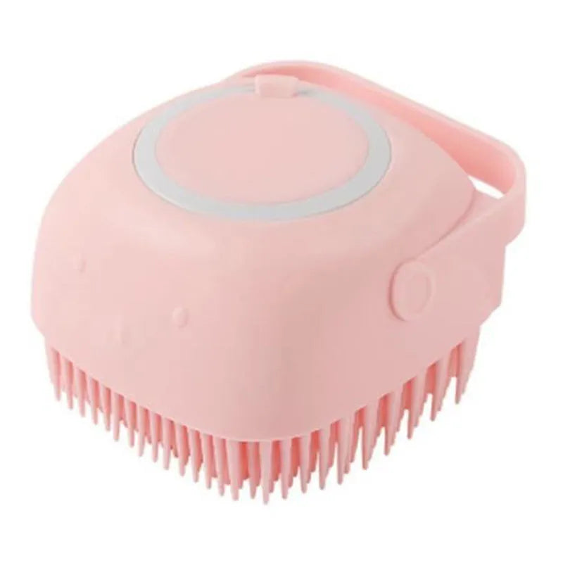 Pink silicone scalp massage brush with handle and soft flexible bristles