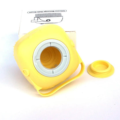 Yellow silicone massage bath brush with removable cap and packaging on white background